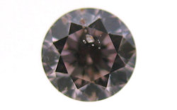 天然ガーネットと思われる結晶入りピンクダイヤモンドルース画像